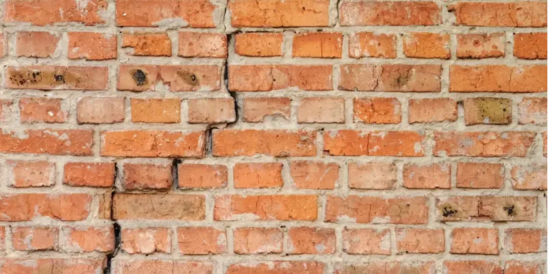Brick wall cracking showing signs of a foundation problem.