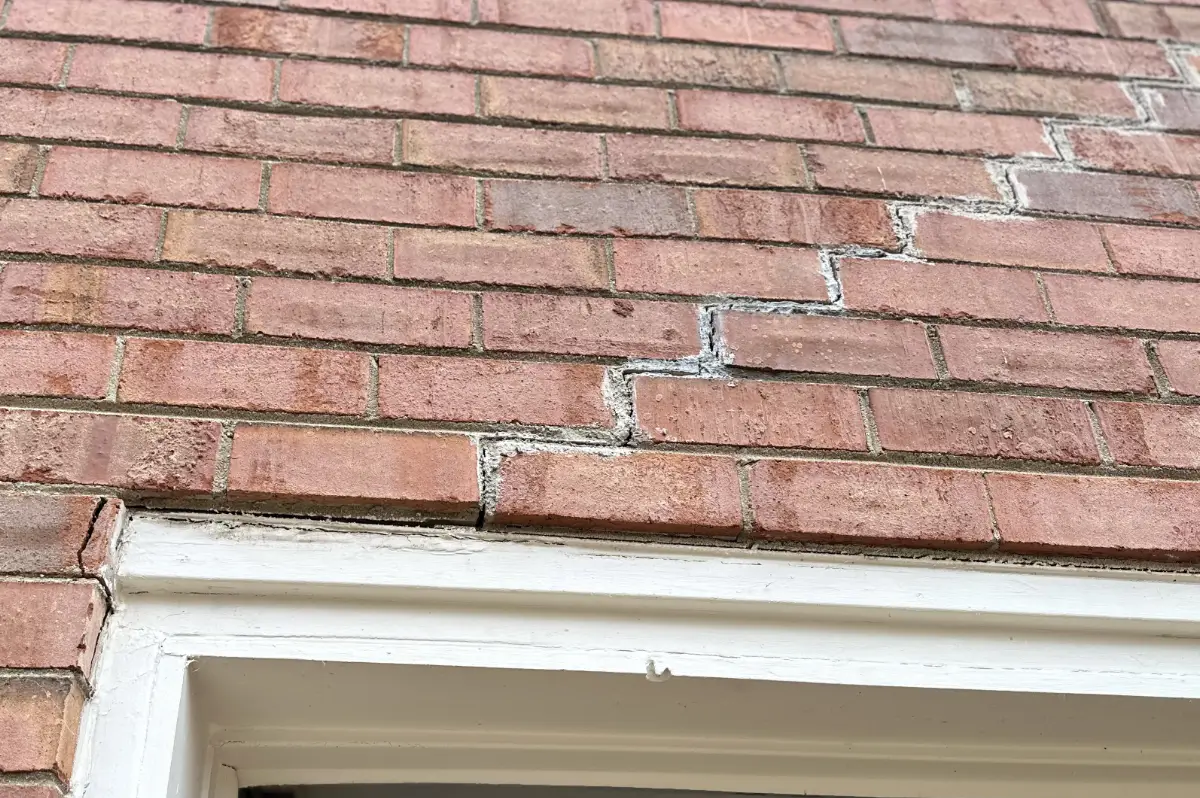 Foundation shifting is causing this brick to fail along the garage.