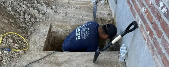 Diggin though the foundation to repair cracks and stabilize.