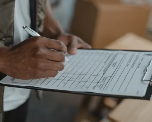 Person calculating bills.