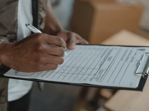 Person calculating bills.